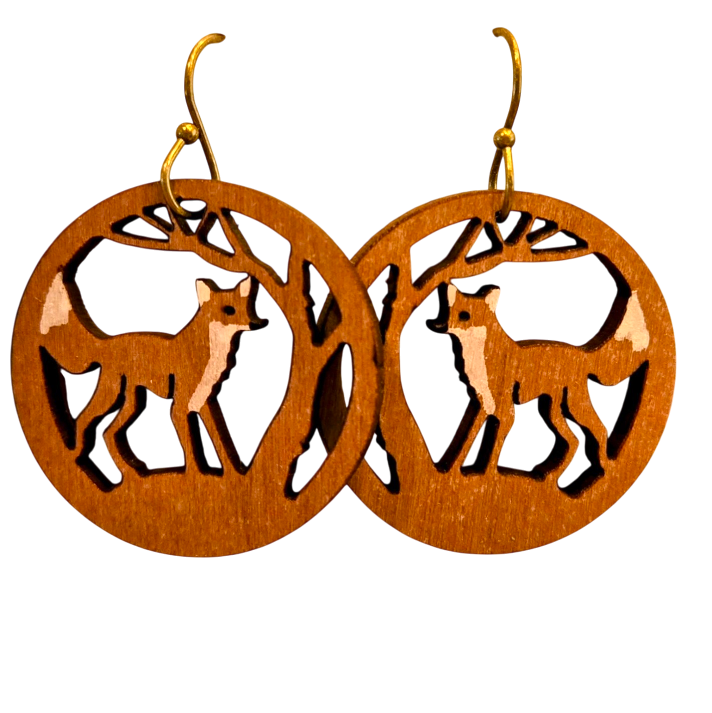 A pair of wooden dangle earrings with laser-cut fox and tree designs, featuring gold-tone fishhook ear wires, shown against a plain white background.