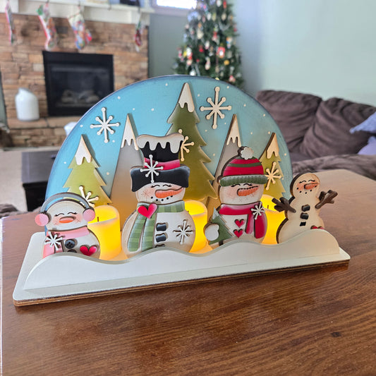 Snowman Family Candlelight Scene