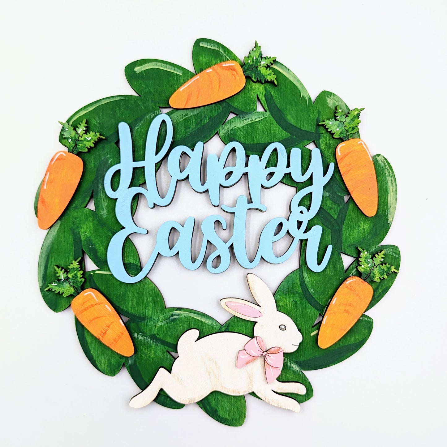 Hand-painted wooden Easter wreath with bunny and carrots, perfect for decorating your home for the holiday season