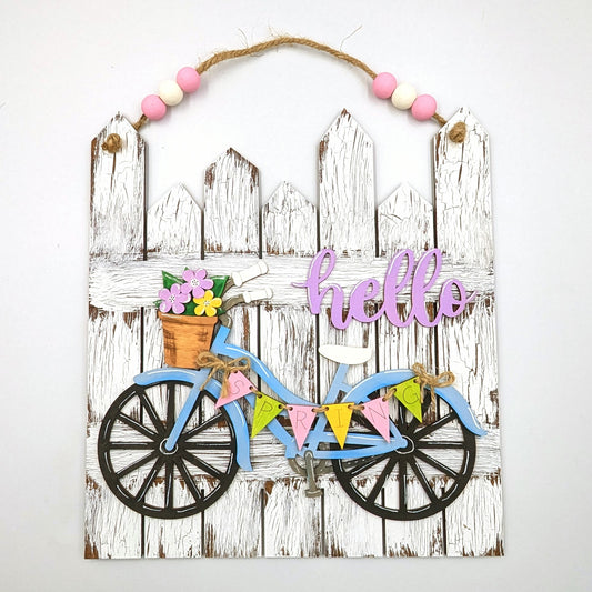 Spring-themed bicycle wall hanging with flowers