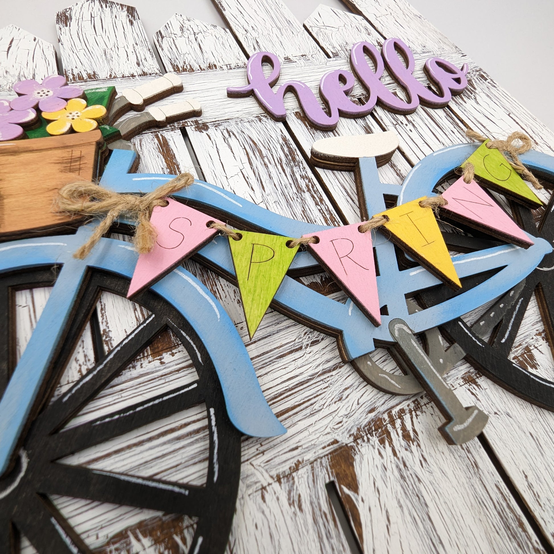 Spring-themed bicycle wall hanging with flowers